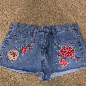 Jean shorts with flowers on them
